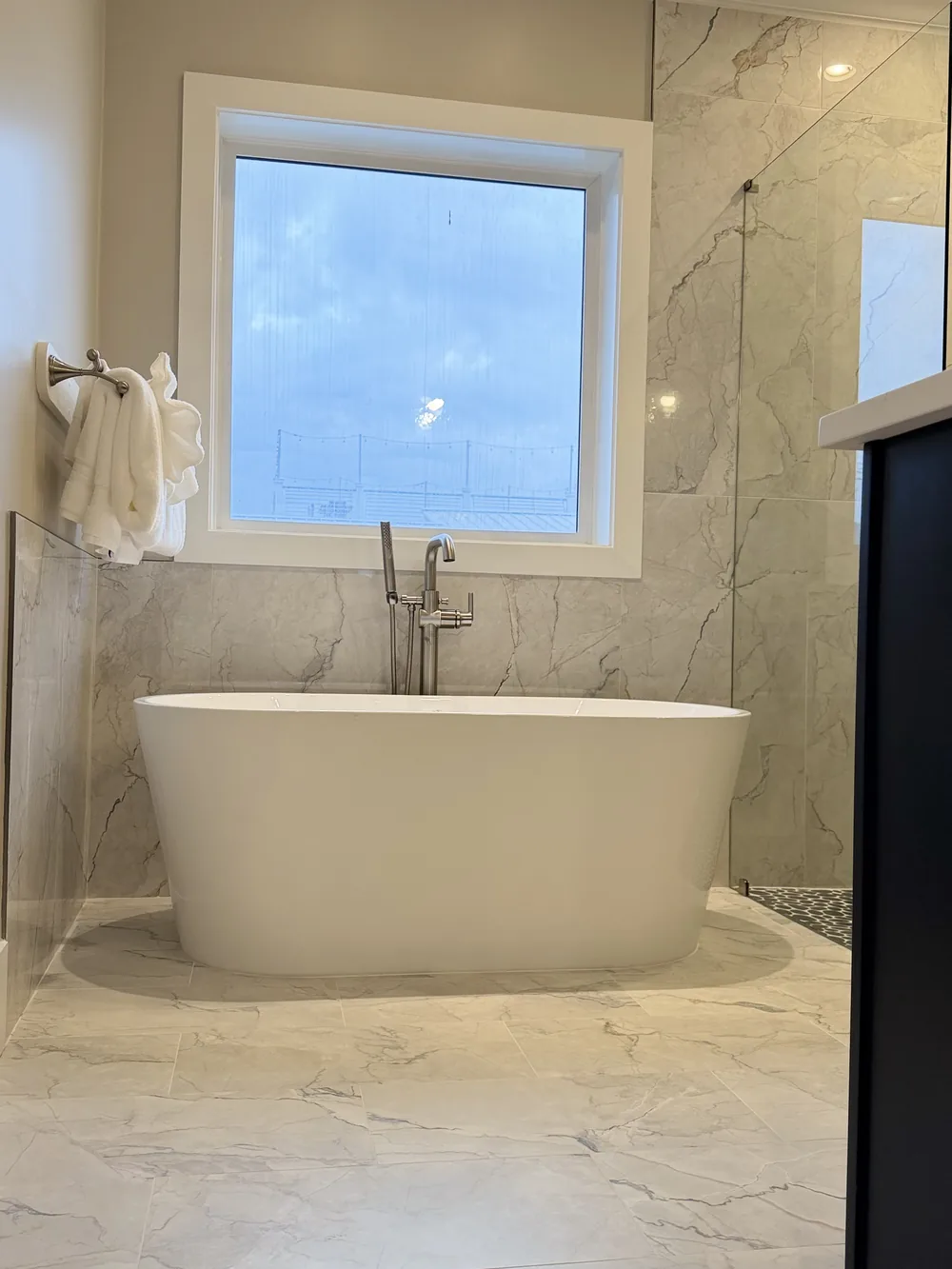 Marble bathroom with a bathtub
