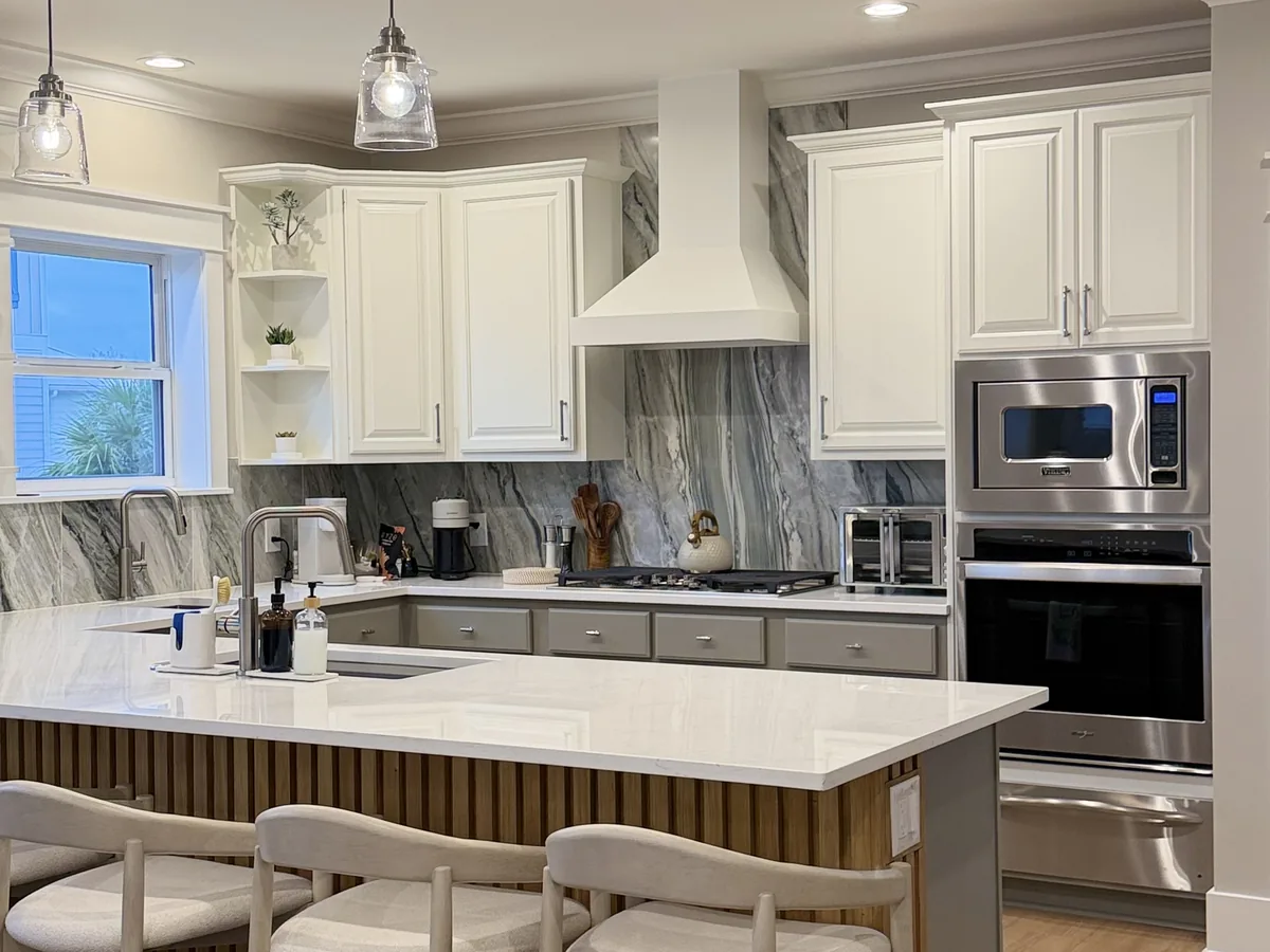Remodeled kitchen with an island and a range hood